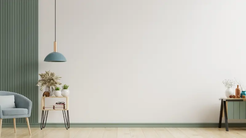 L'intérieur présente un fauteuil sur un mur blanc vide, rendu 3D