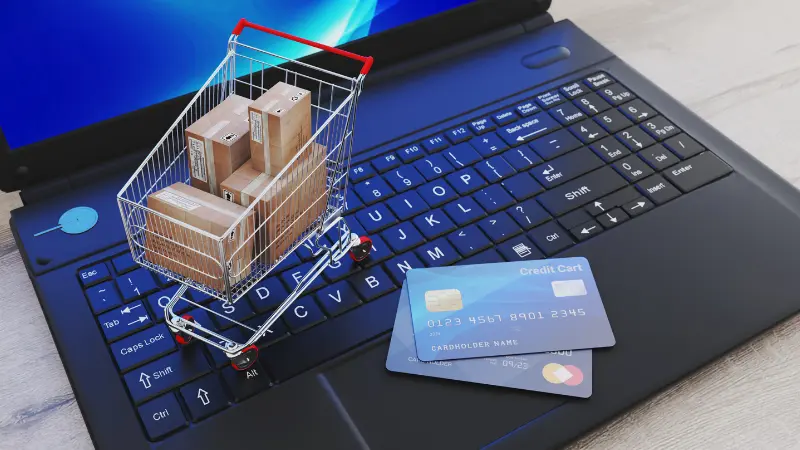 e-commerce hybride, acheter des biens sur internet, ordinateur, chariot et cartes bancaires